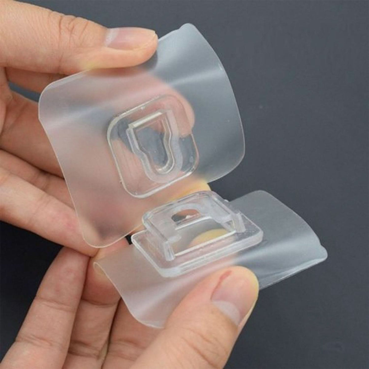 Transparent self-adhesive wall hook, side view