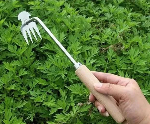 Manual garden weeding tool with ergonomic grip handle