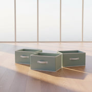 Set of three light grey fabric wardrobe storage boxes with handles